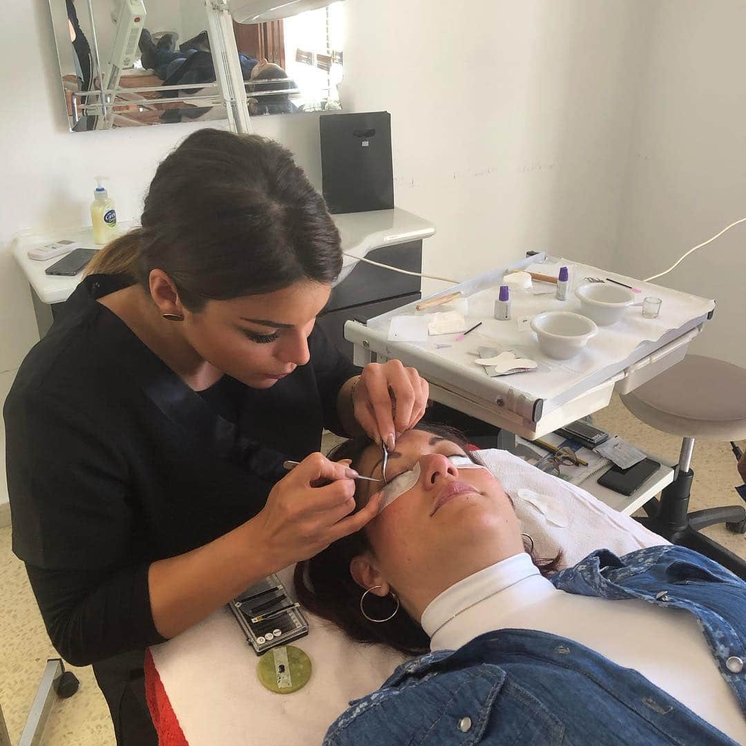 A student receiving supervised practical beauty training